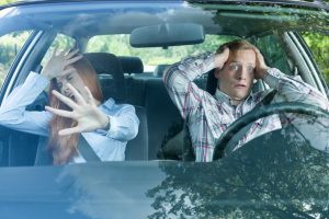 couple in a car about to have a crash